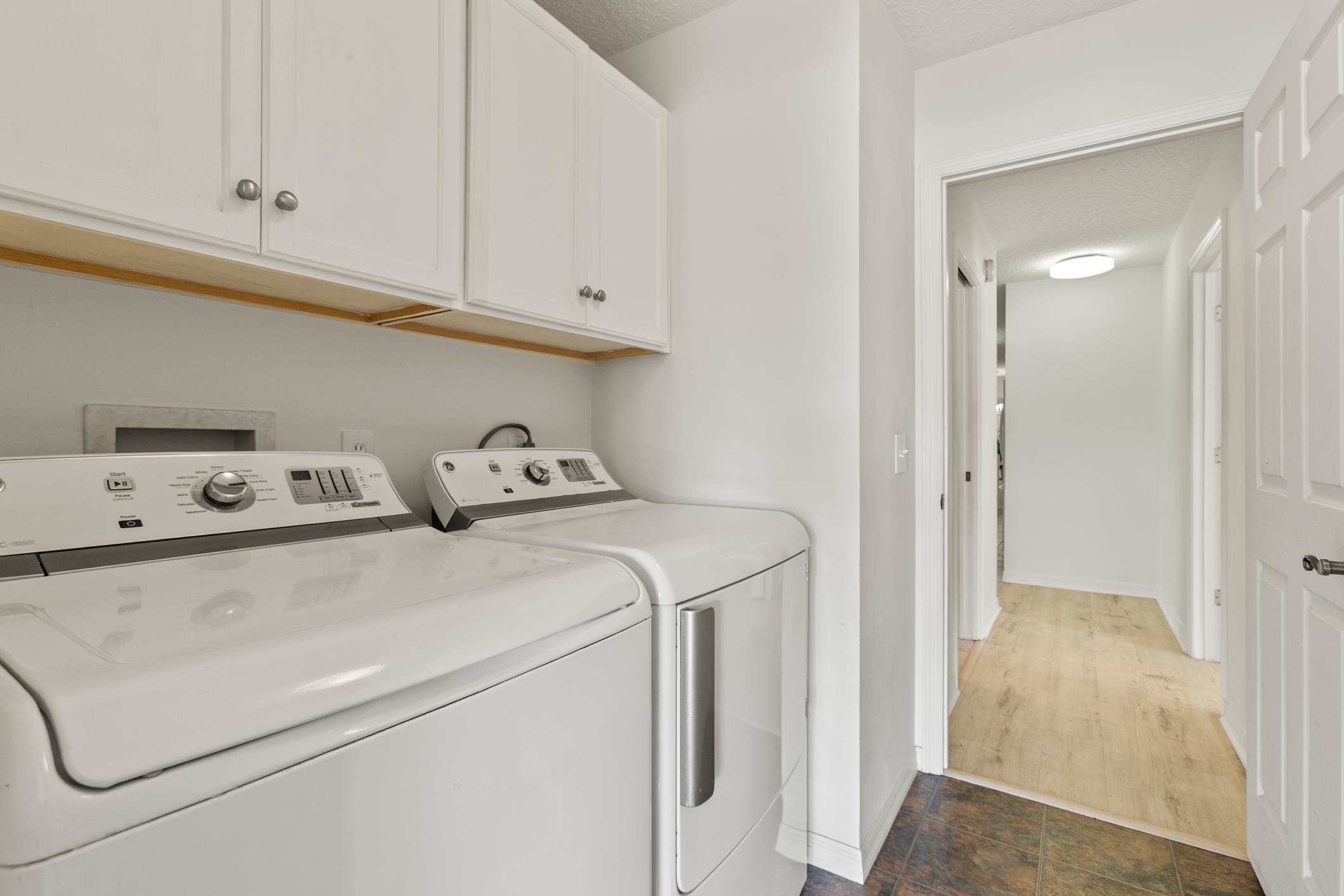 541 Peninsula Court St. Augustine, FL 32080 - Photo 50 of 63 Laundry area with cabinet space and washer and dryer
