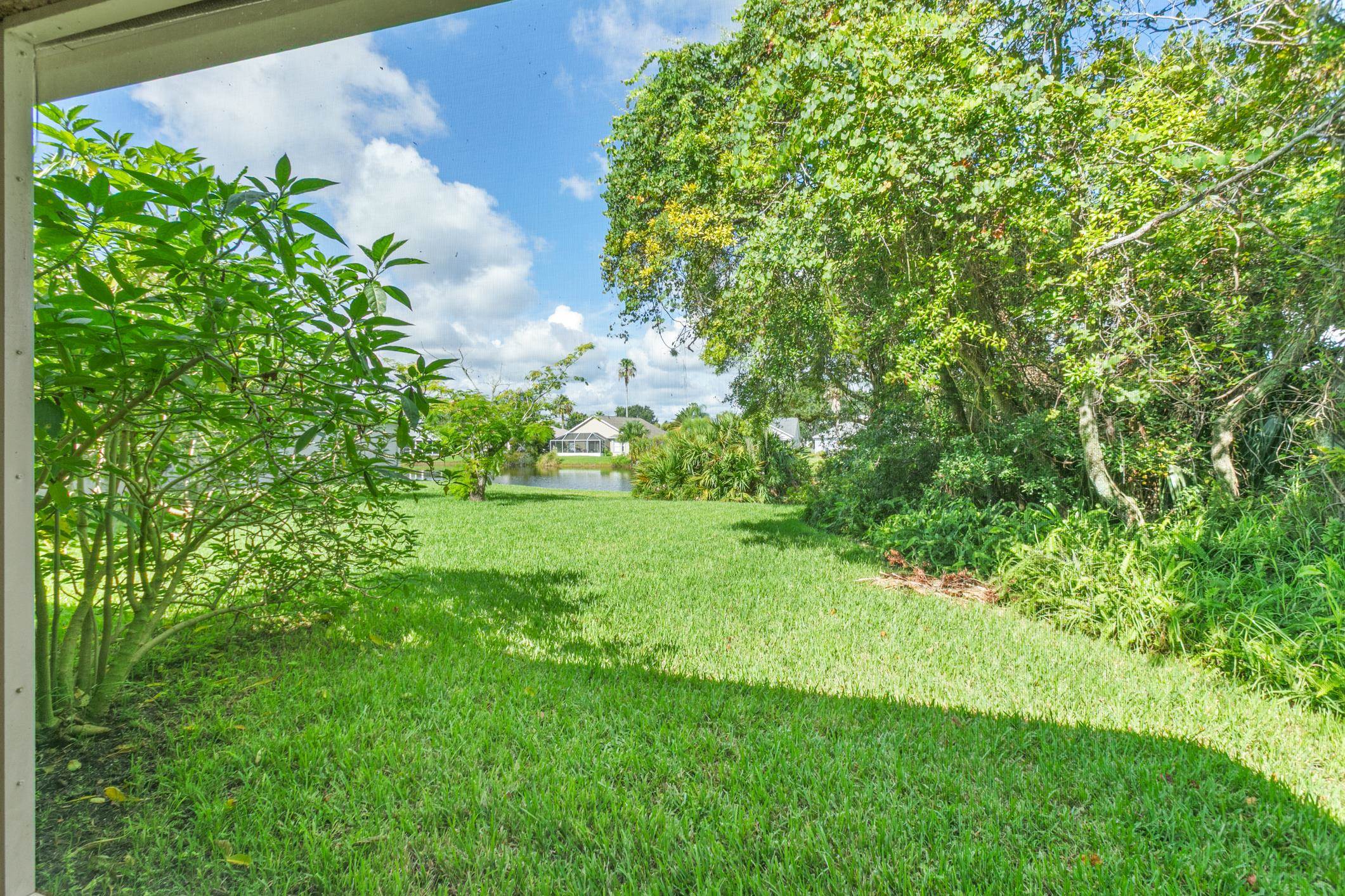 541 Peninsula Court St. Augustine, FL 32080 - Photo 63 of 63 a view of a yard with a tree