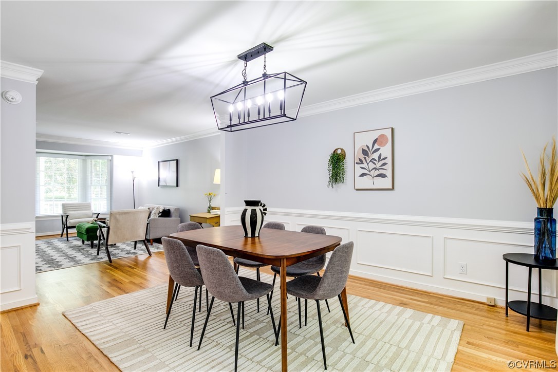 5709 Ridge Point Court Midlothian, VA 23112 - Photo 12 of 40 a view of a dining room with furniture and wooden floor