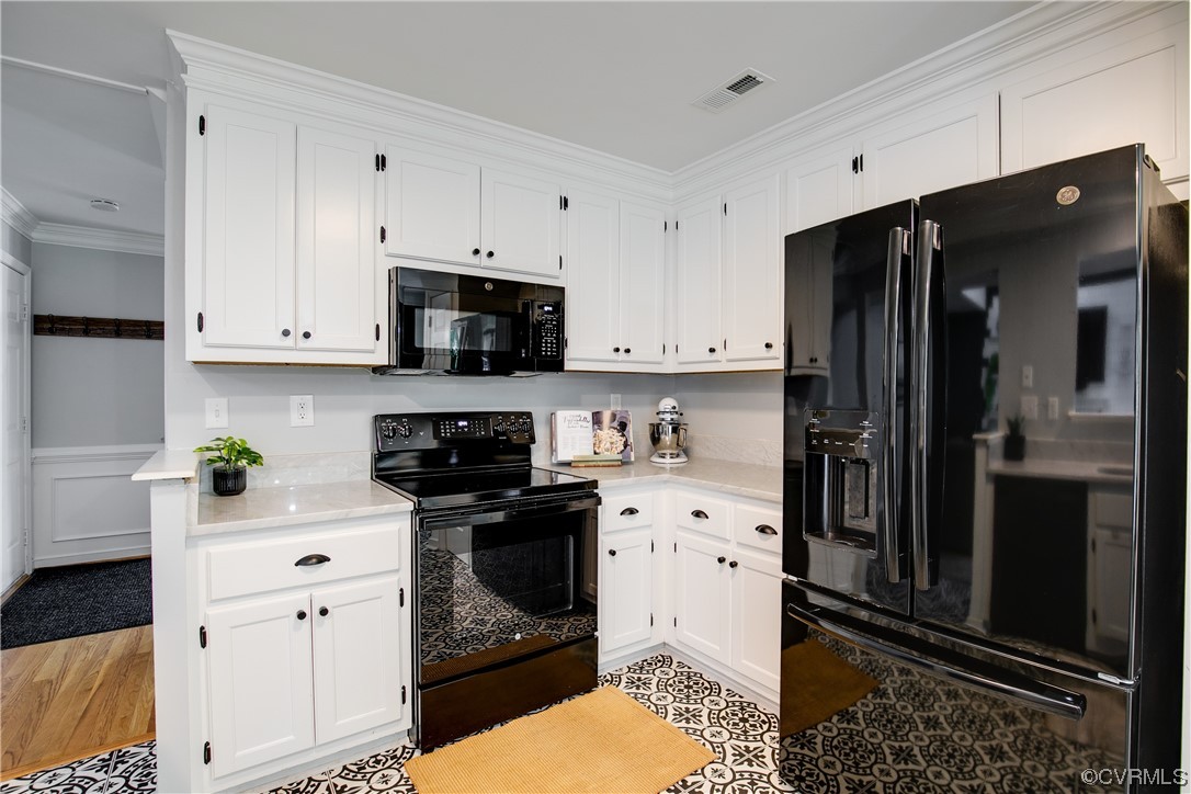 5709 Ridge Point Court Midlothian, VA 23112 - Photo 18 of 40 a kitchen with stainless steel appliances a stove a refrigerator and a sink