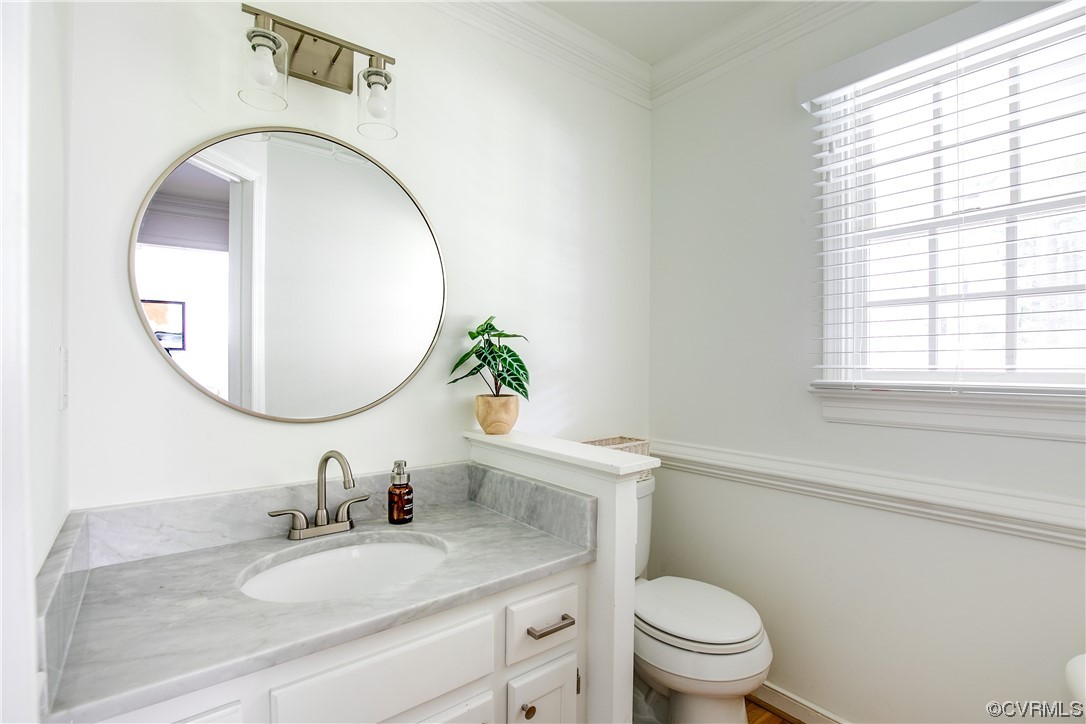 5709 Ridge Point Court Midlothian, VA 23112 - Photo 23 of 40 a bathroom with a granite countertop toilet a sink and a mirror