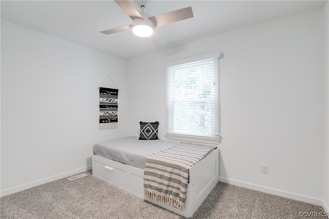 5709 Ridge Point Court Midlothian, VA 23112 - Photo 29 of 40 a room with a bed and a window