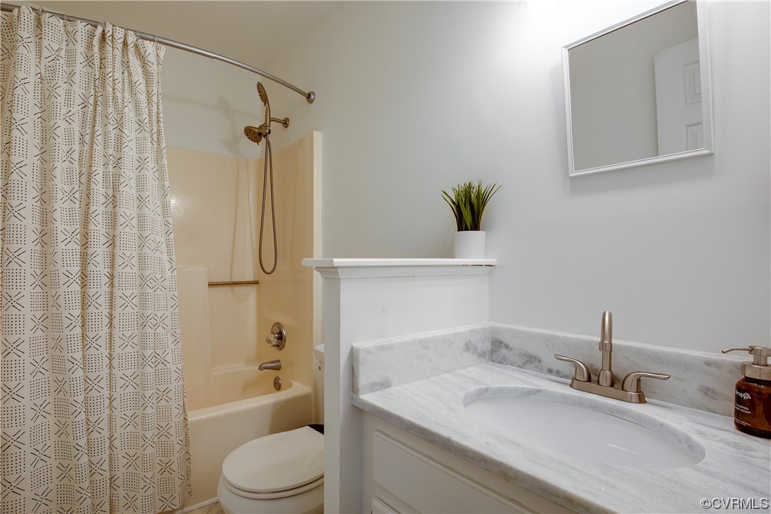 5709 Ridge Point Court Midlothian, VA 23112 - Photo 31 of 40 a bathroom with a granite countertop sink toilet and shower
