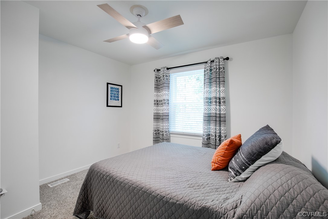 5709 Ridge Point Court Midlothian, VA 23112 - Photo 33 of 40 a bedroom with a bed and a large window