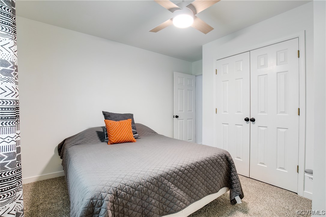 5709 Ridge Point Court Midlothian, VA 23112 - Photo 34 of 40 a bedroom with a bed and a chandelier