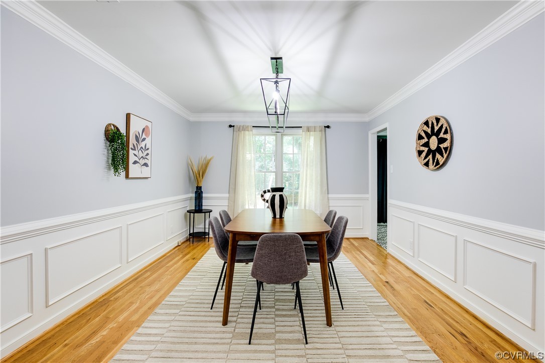 5709 Ridge Point Court Midlothian, VA 23112 - Photo 10 of 40 a view of a dining room with furniture a chandelier and wooden floor