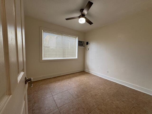 6440 2nd Street, Unit 9 Stock Island, FL 33040 - Photo 11 of 14 an empty room with windows and fan
