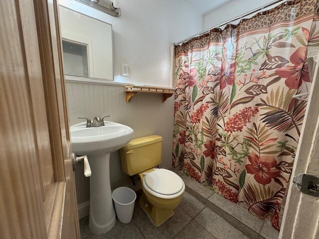 6440 2nd Street, Unit 9 Stock Island, FL 33040 - Photo 13 of 14 a white toilet sitting next to a bathroom sink