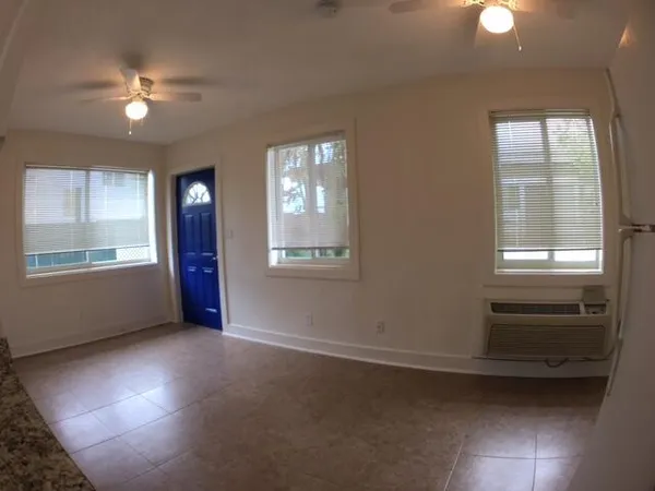 a view of an empty room with a window