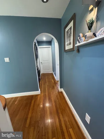 a view of entryway with wooden floor