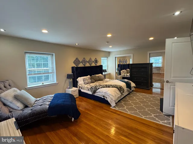 a bedroom with a bed and a couch