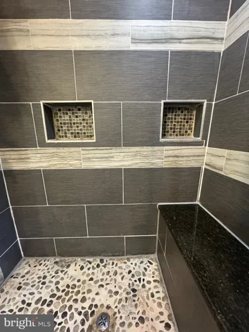 a bathroom with a sink and a shower