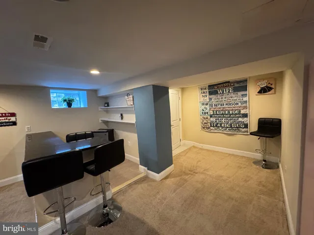a kitchen with granite countertop a refrigerator stove and sink