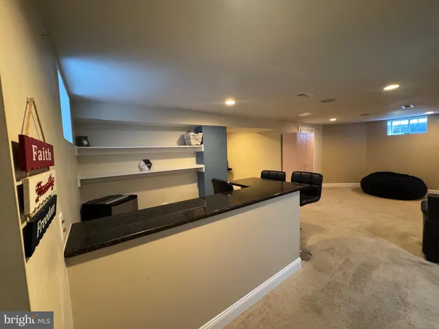 a kitchen with stainless steel appliances a sink and a refrigerator