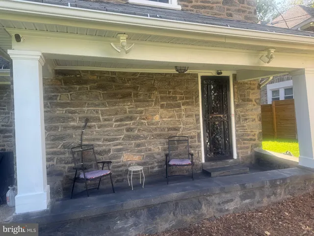 a view of a room with chairs and a table
