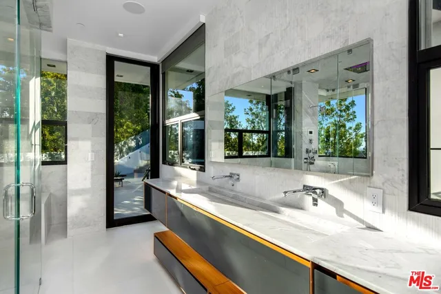 a bathroom with sink and mirror
