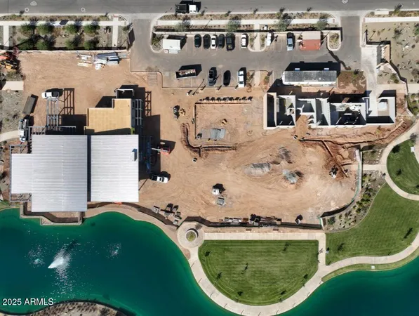 an aerial view of a house with yard swimming pool and outdoor seating