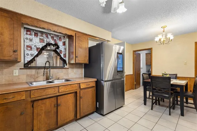 a kitchen that has a cabinets and a table in it