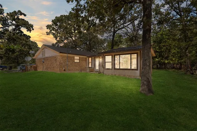 a backyard of a house with lots of green space