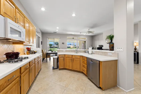 a kitchen with counter top space and cabinets