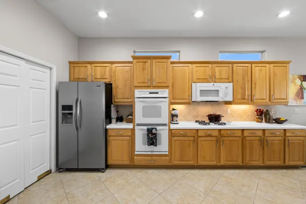 a kitchen with stainless steel appliances a refrigerator and a sink
