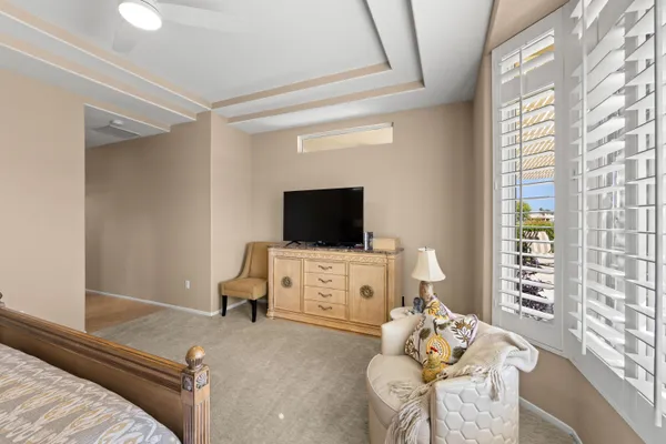 a bedroom with furniture and a window