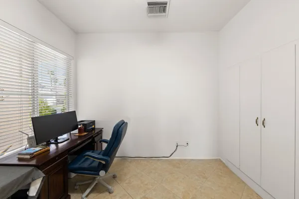 a workspace with furniture and a window