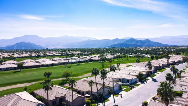 a view of a city with mountains in the background
