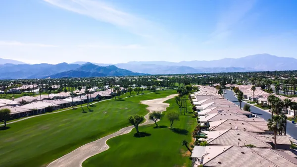 a view of a city with mountains in the background