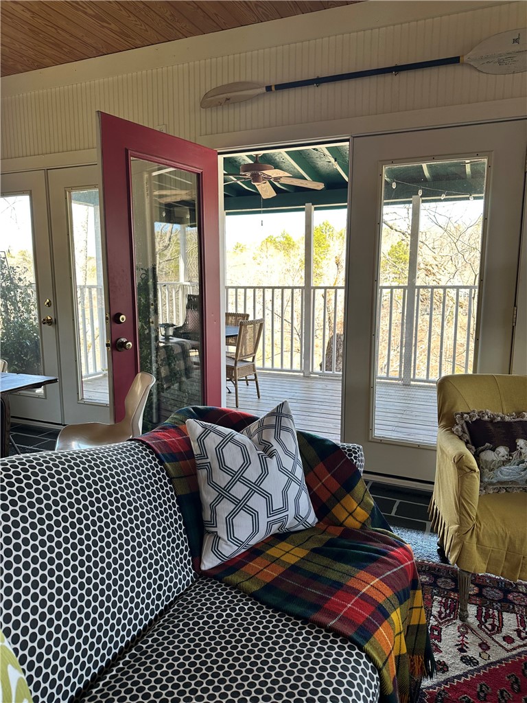 215 Ridge Road Westminster, SC 29693 - Photo 14 of 42 This inviting space seamlessly connects to the outdoors through multiple glass doors leading to a spacious deck.