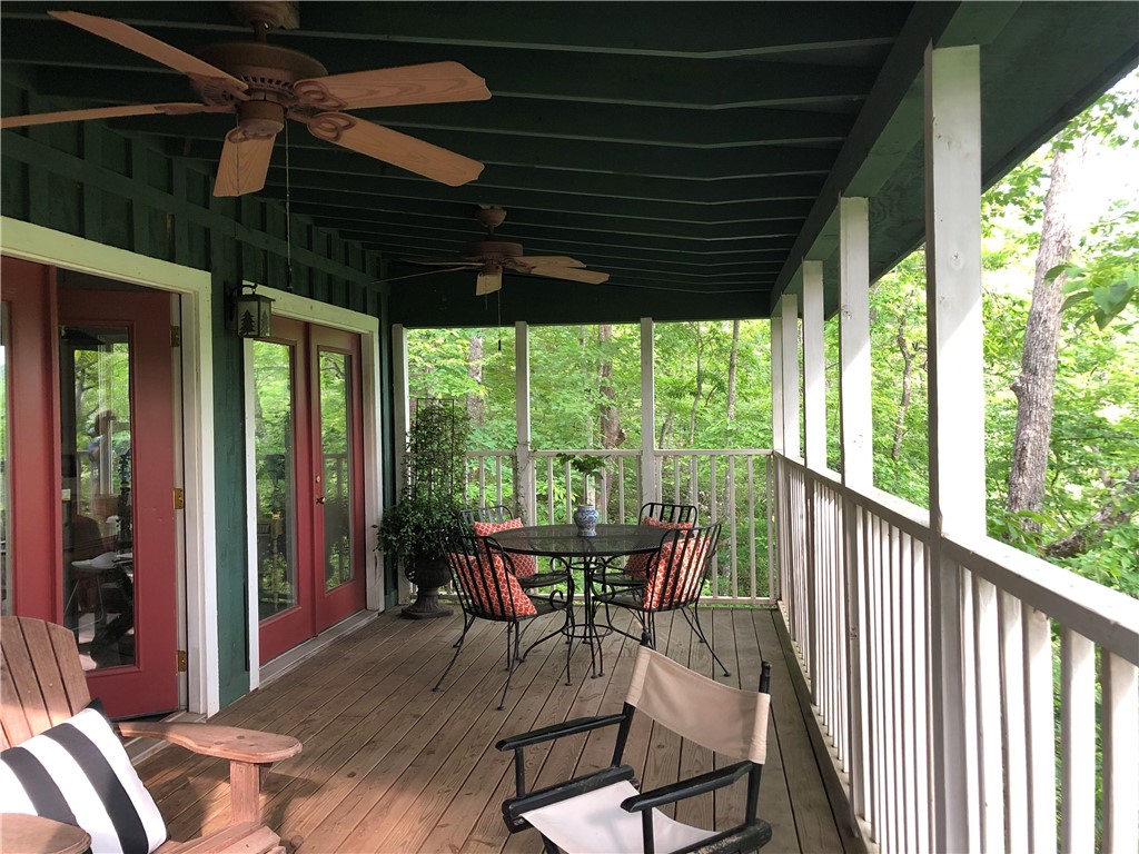 215 Ridge Road Westminster, SC 29693 - Photo 15 of 42 Relax on this expansive porch, featuring ample space for dining and seating area overlooking the water