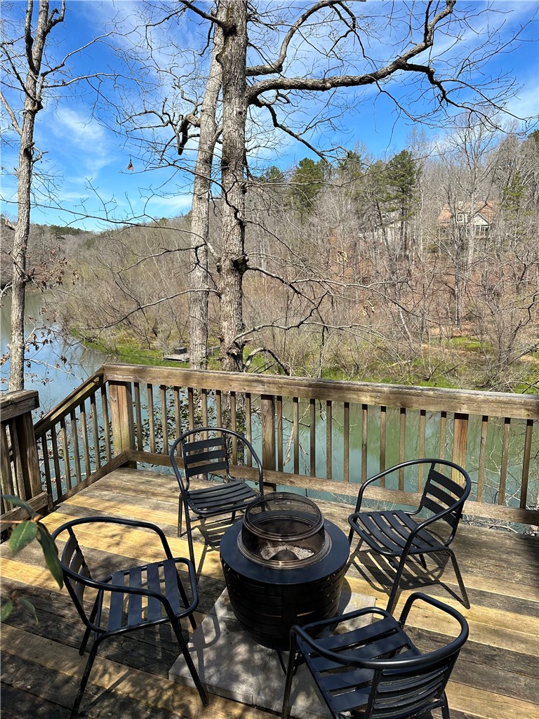 215 Ridge Road Westminster, SC 29693 - Photo 38 of 42 Enjoy tranquil water views from this inviting outdoor deck with firepit