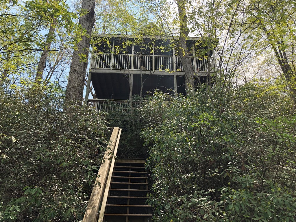 215 Ridge Road Westminster, SC 29693 - Photo 41 of 42 This charming treetop retreat offers an elevated living experience amidst lush greenery.