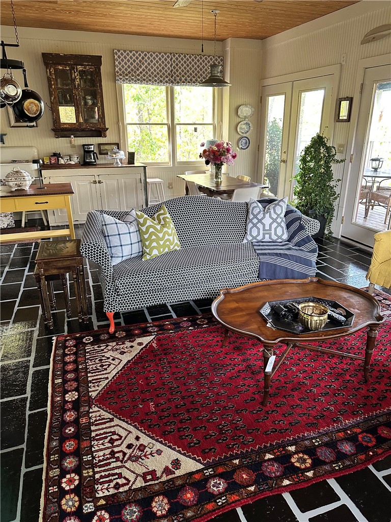 215 Ridge Road Westminster, SC 29693 - Photo 6 of 42 Living area is charming, bright and airy. Whimsical details abound - check out the legs on the sofa !