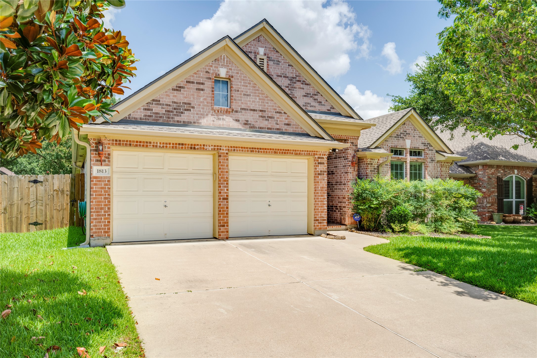 A well-maintained brick exterior and concrete driveway welcome you to this inviting residence.