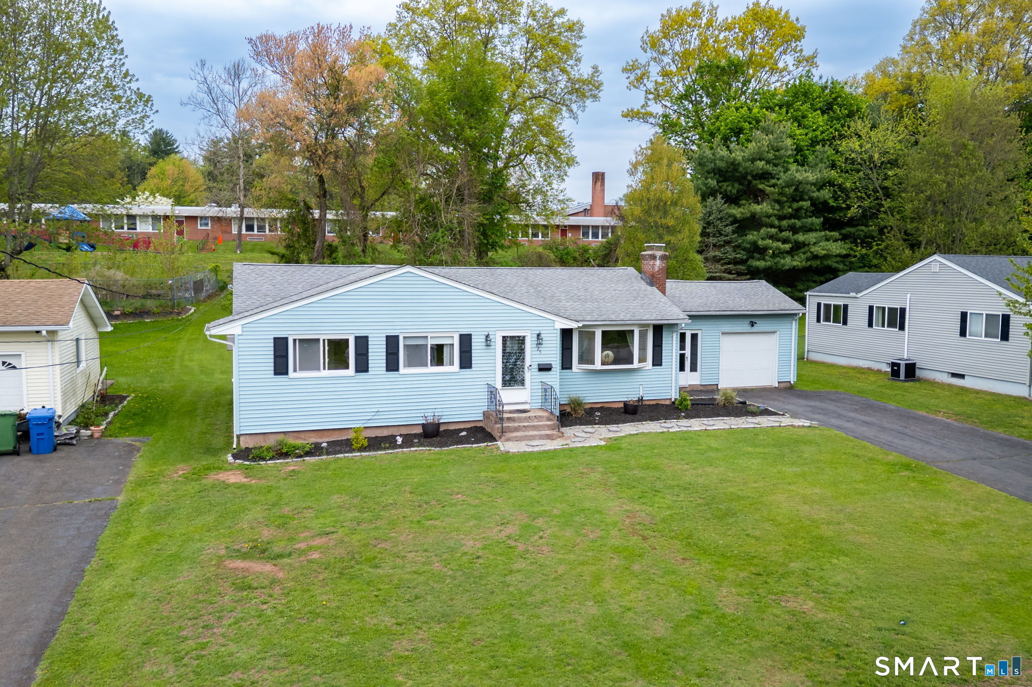 325 Barbara Road Middletown, CT 06457 - Photo 37 of 40 a front view of a house with yard and green space