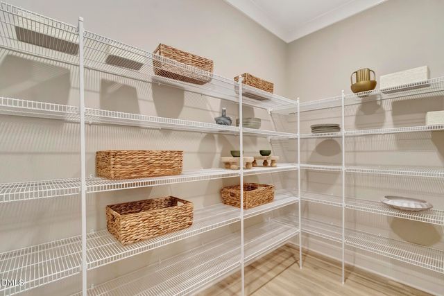 a view of a closet with empty racks