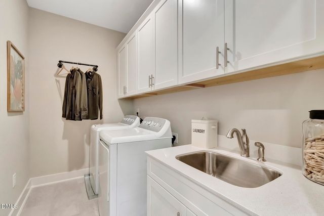 a bathroom with a sink and vanity