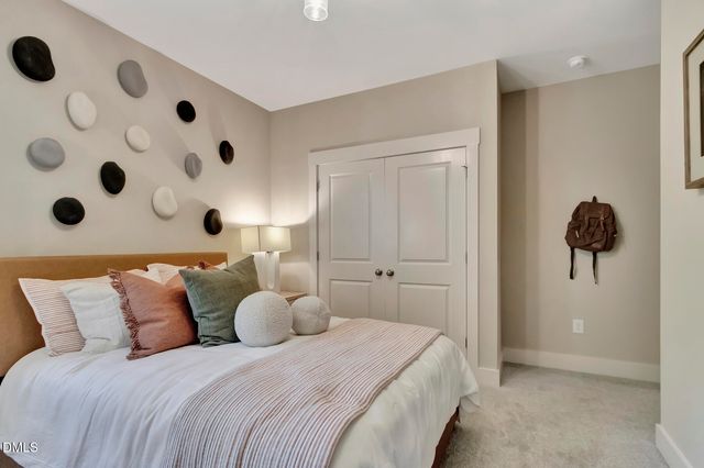 a large white bed in a white room