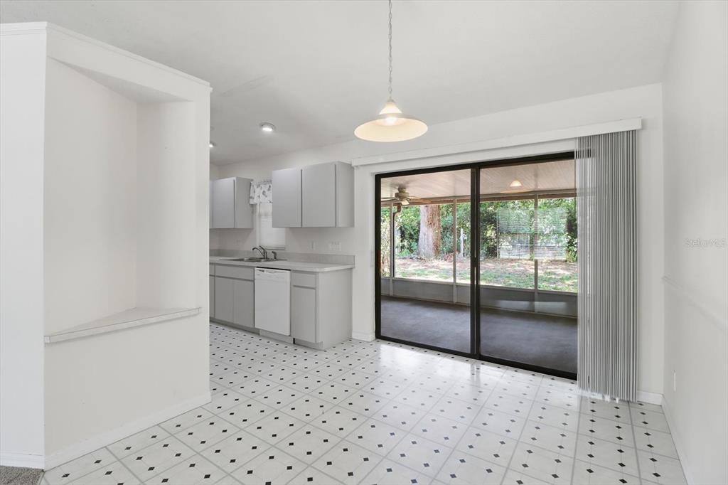 6355 East Rush Street Inverness, FL 34452 - Photo 10 of 27 a kitchen with granite countertop a refrigerator and a sink