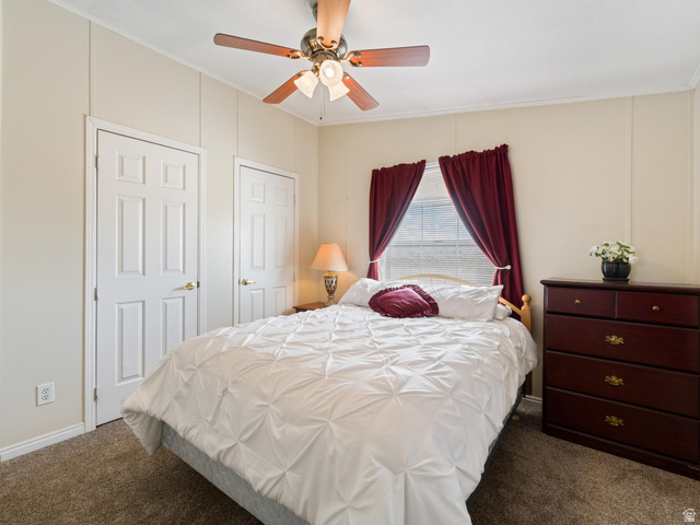 3941 West 40 North Hurricane, UT 84737 - Photo 27 of 55 Bedroom featuring carpet flooring, two paneled doors, and a window with blinds