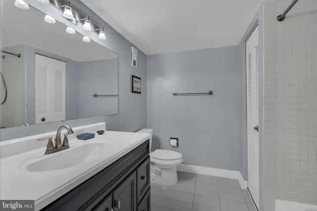 a bathroom with a sink double vanity and a shower
