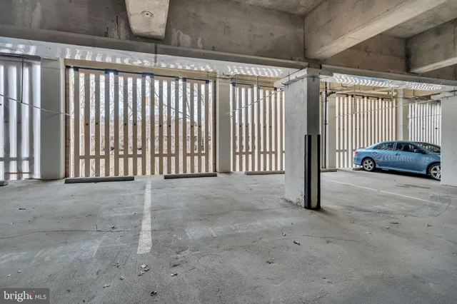 a view of parking garage with cars