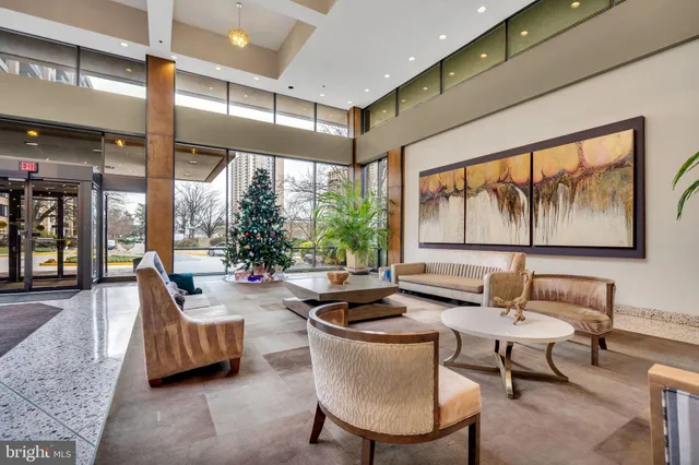 a lobby with furniture and outdoor view