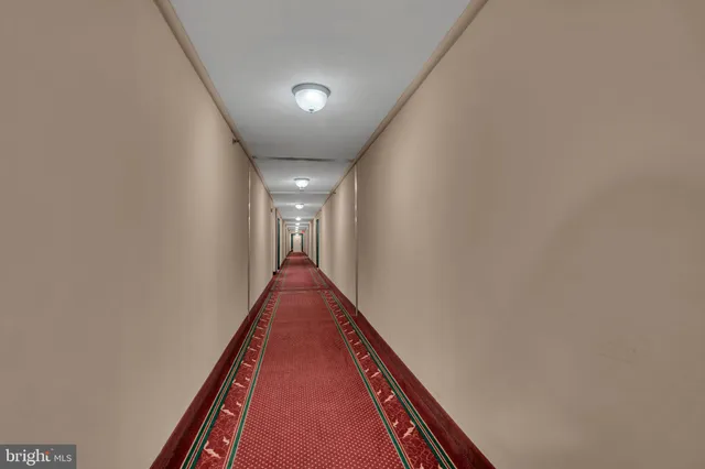a view of a hallway with stairs