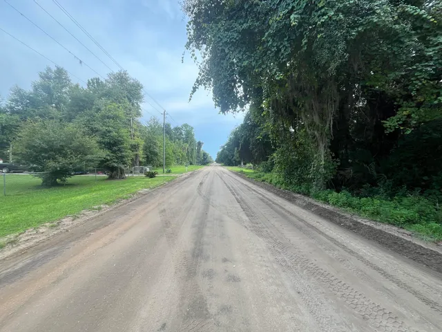 a view of a road with a yard