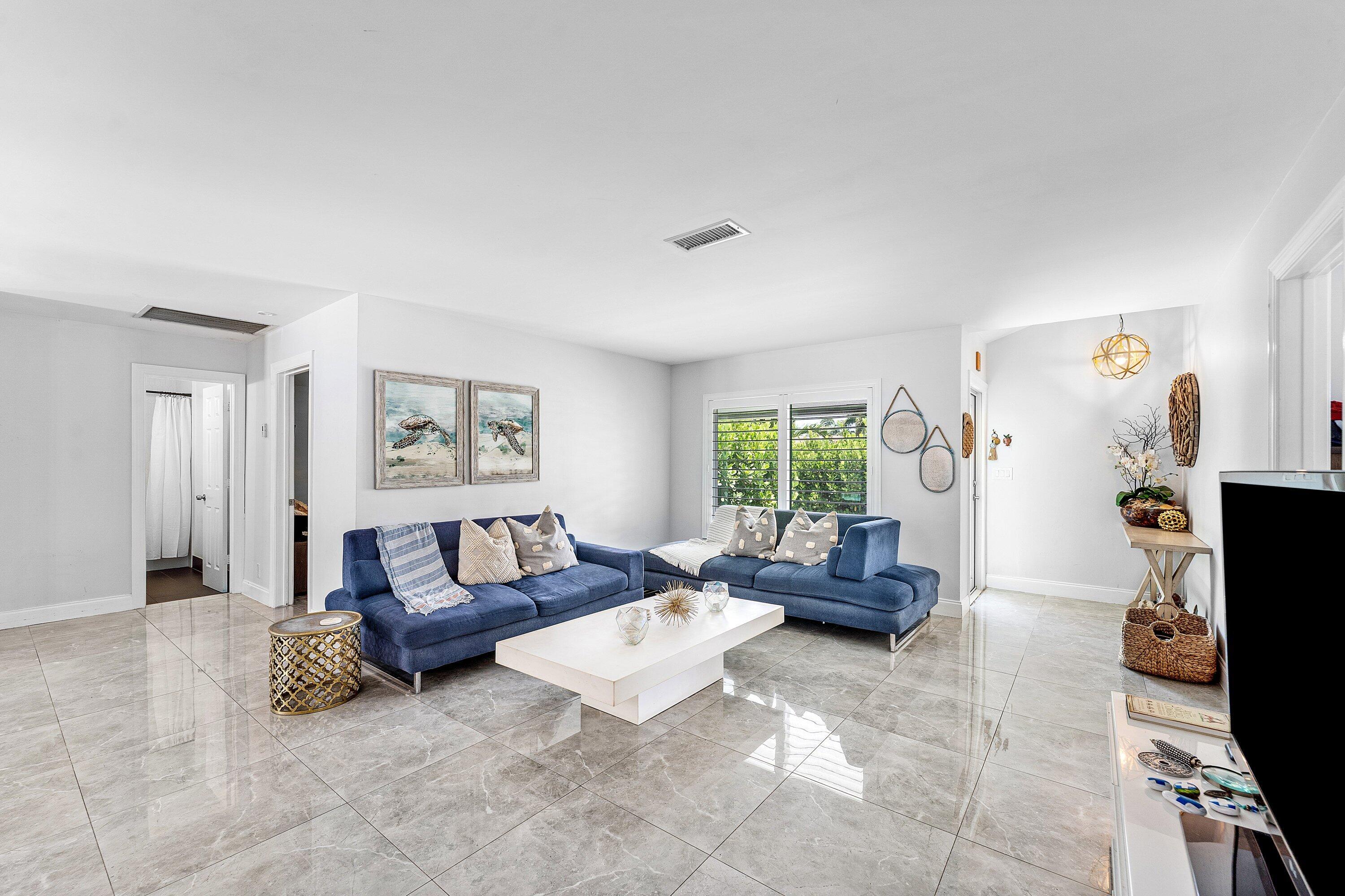 581 Northwest 13th Drive Boca Raton, FL 33486 - Photo 6 of 39 a living room with furniture and a window