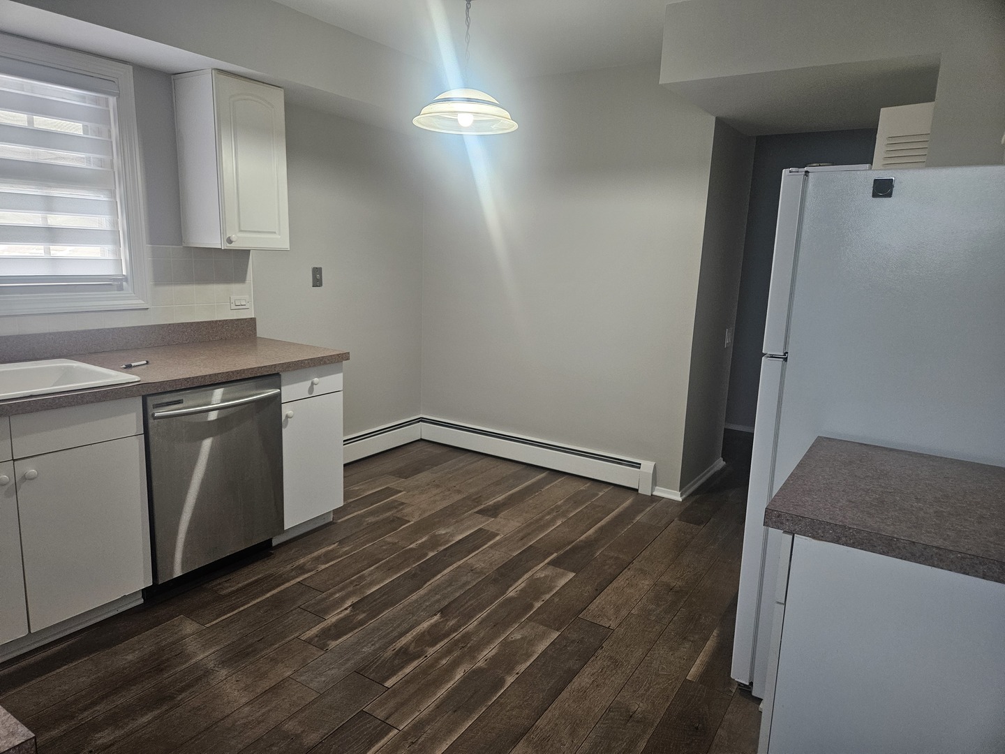 863 North Northwest Highway, Unit 2 Park Ridge, IL 60068 - Photo 12 of 22 a kitchen with a sink and wooden floor