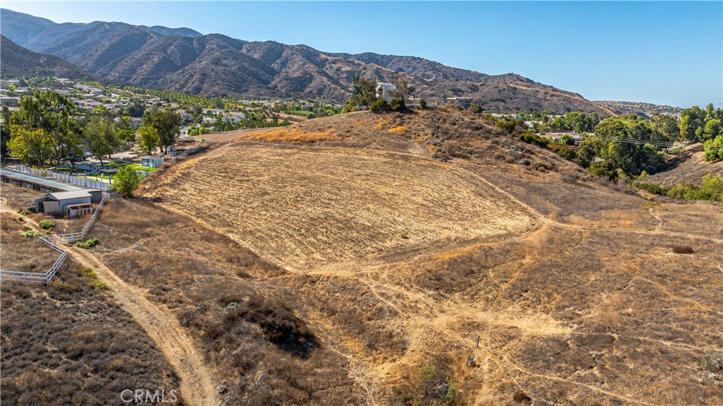 0 Knabe Road Corona, CA 92883 - Photo 18 of 23 a view of a dry yard with mountains in the background