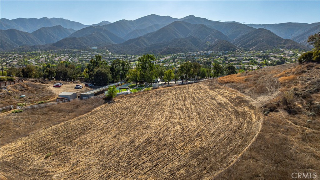 0 Knabe Road Corona, CA 92883 - Photo 19 of 23 a view of a house with a field
